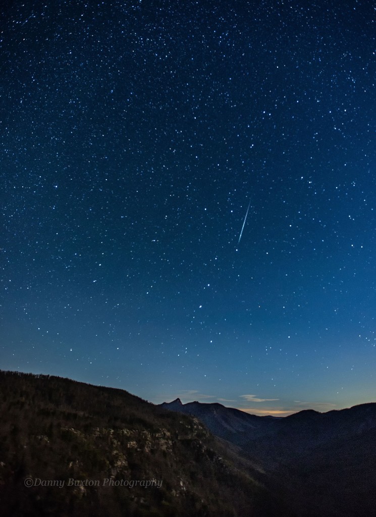 Stars above Linville Gorge.  Meteor streaks down over Table Rock. (Photo: Danny Buxton)